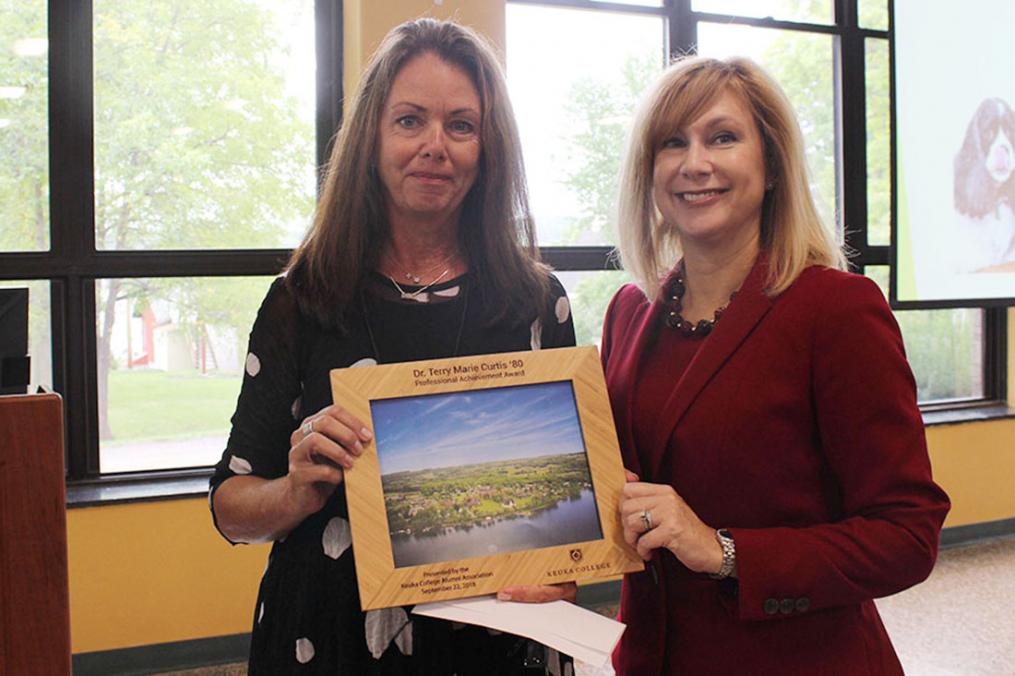 Dr. Terry Curtis '80, left, receives the Keuka College Alumni Association's Professional Achievement Award from College President Amy Storey.