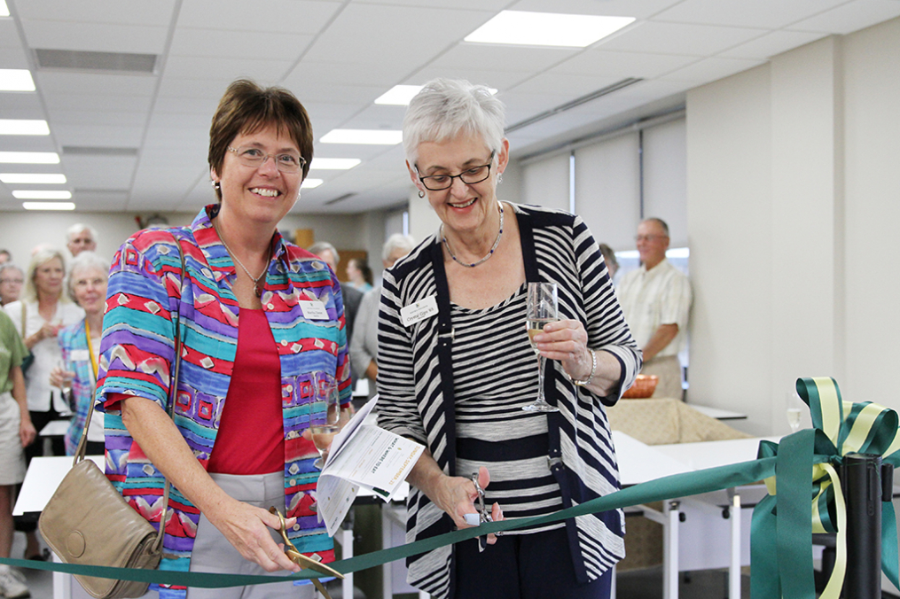 College trustees Martha Fallon Dieter, left, and Crystal J. Gips ’65 cut the ceremonial ribbon Friday evening formally opening the College's new Center for Art &amp; Design. 